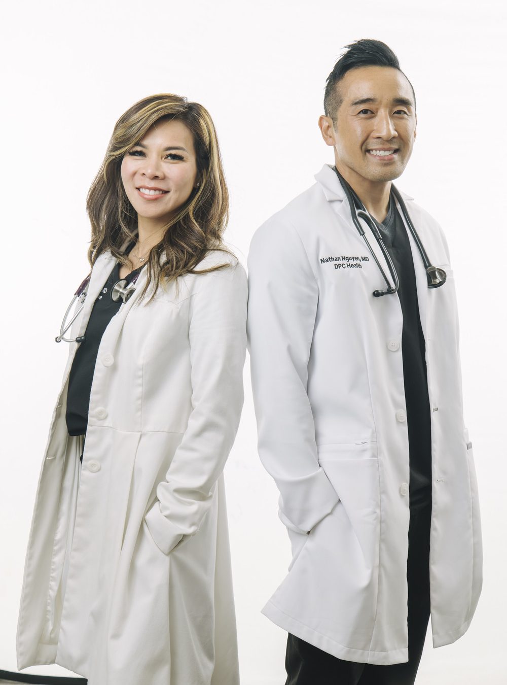 Dr. Nathan Nguyen consulting with a patient about peptide therapy